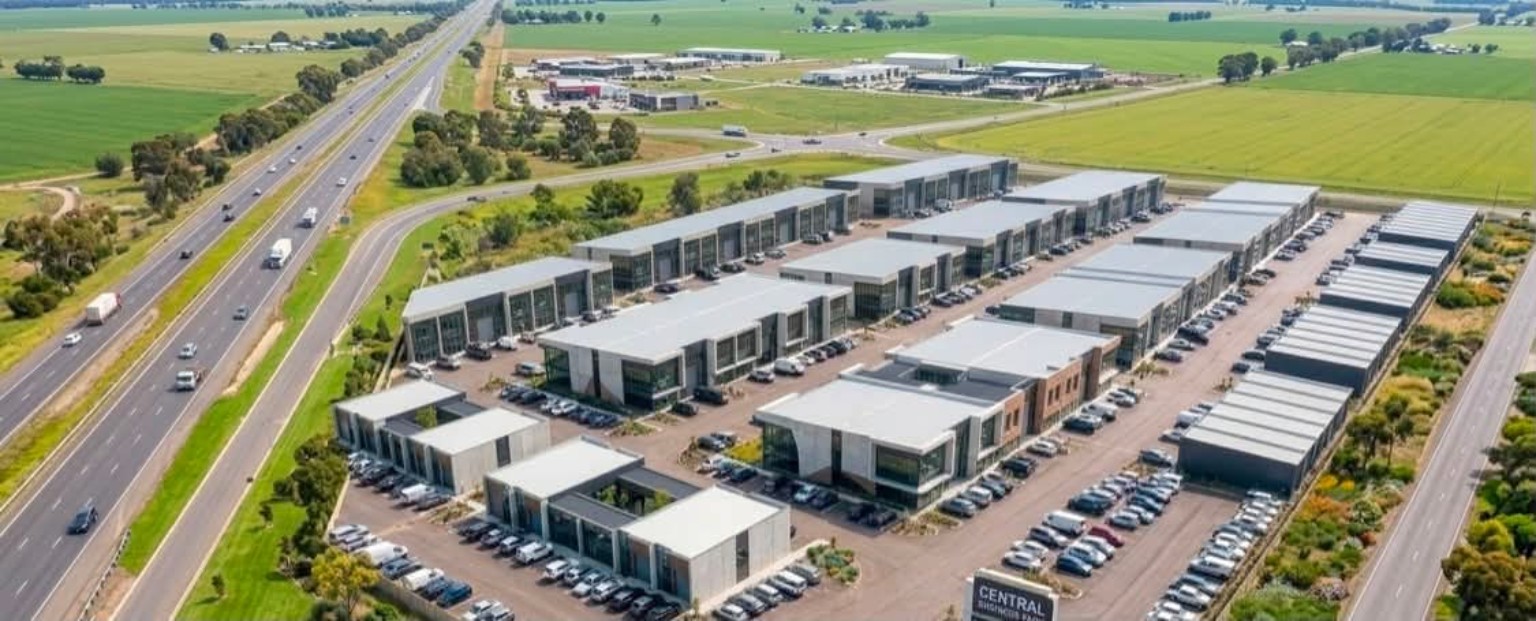 Aerial view of a modern flex-industrial business park near a highway